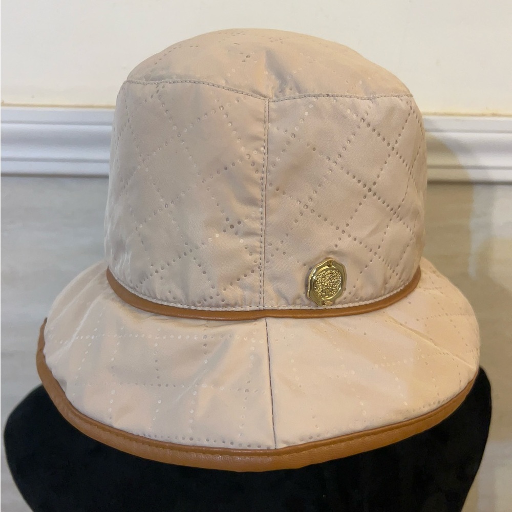 Vince Camuto Quilted Cream Bucket Hat with Tan Trim and Gold Emblem